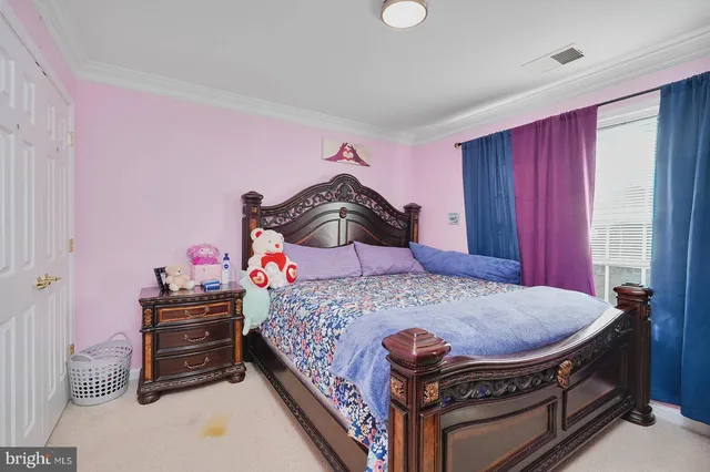 a bed room with a bed and a dresser