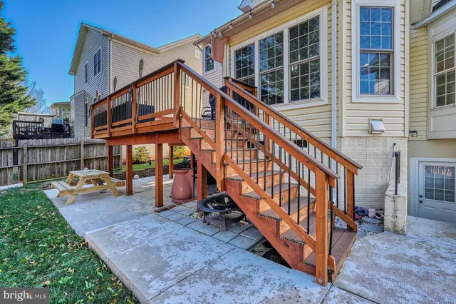 a view of a house with a yard and deck