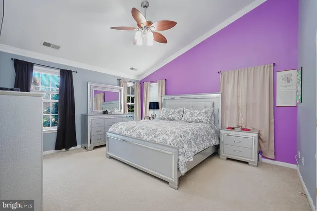 a bed room with a bed and a chandelier