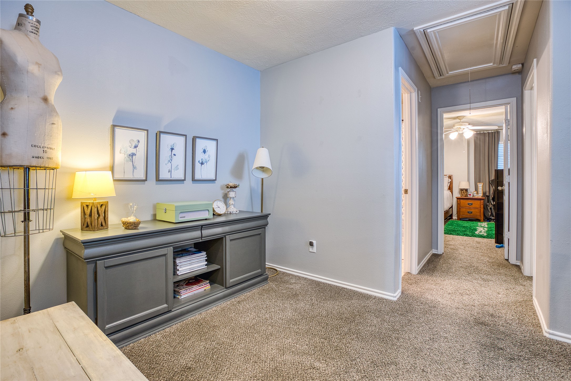 280 Brandy Ridge Lane Dickinson, TX 77539 - Photo 14 of 27 a view of a bathroom with sink cabinet and a living room