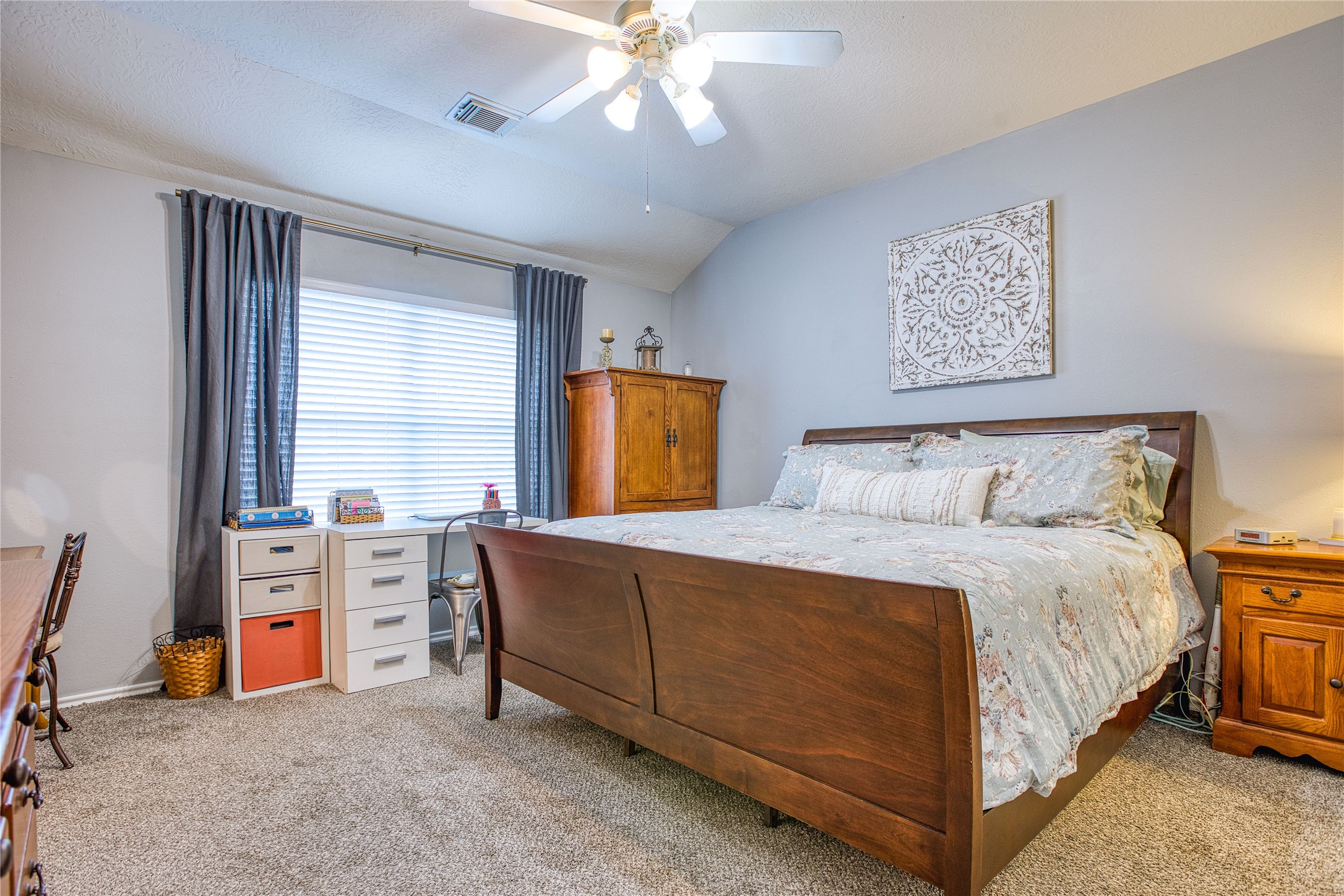 280 Brandy Ridge Lane Dickinson, TX 77539 - Photo 15 of 27 a bedroom with a bed and a chandelier