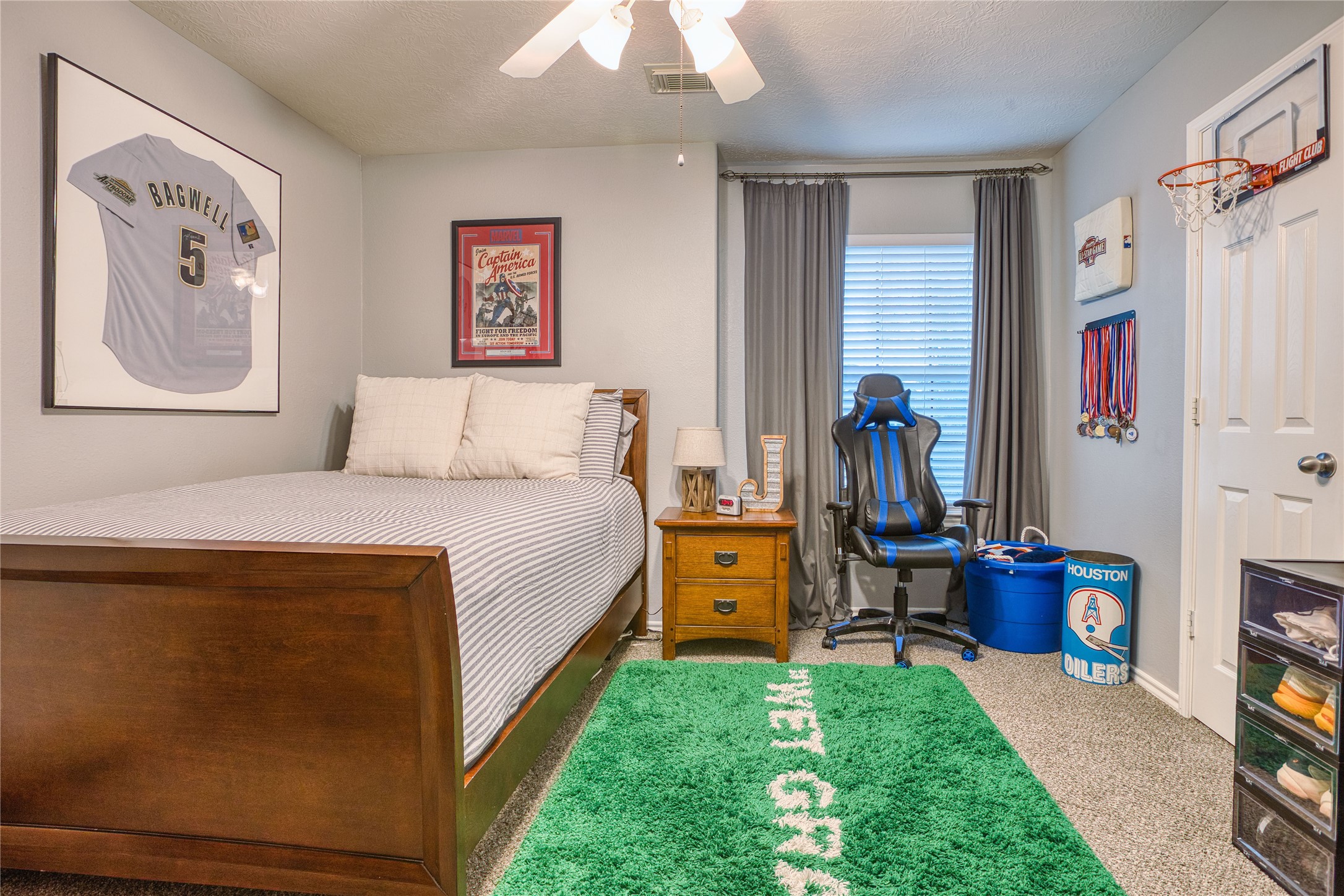280 Brandy Ridge Lane Dickinson, TX 77539 - Photo 20 of 27 a bedroom with a bed and a chandelier