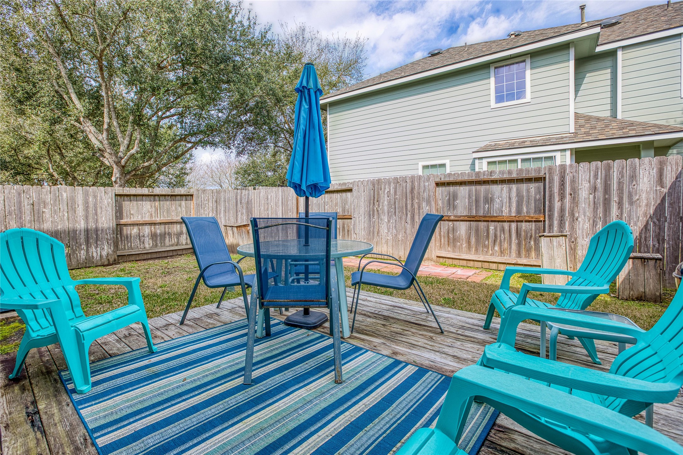 280 Brandy Ridge Lane Dickinson, TX 77539 - Photo 26 of 27 a view of a chairs and table in the balcony