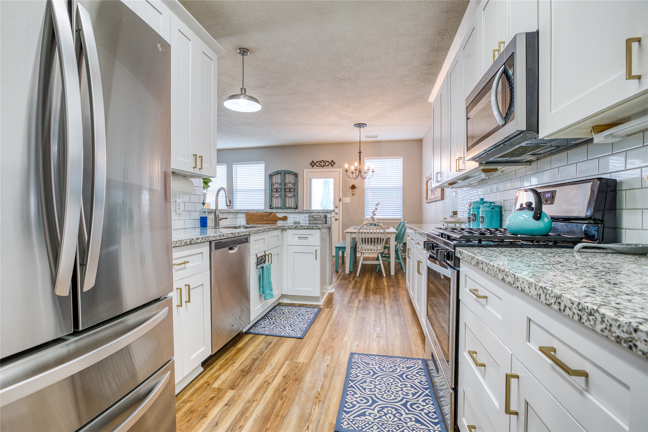 280 Brandy Ridge Lane Dickinson, TX 77539 - Photo 8 of 27 a kitchen with stainless steel appliances granite countertop a refrigerator a stove and a sink