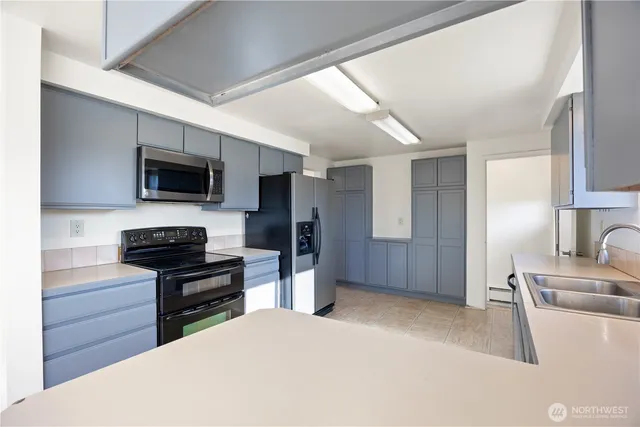 a view of a kitchen with an oven and cabinets