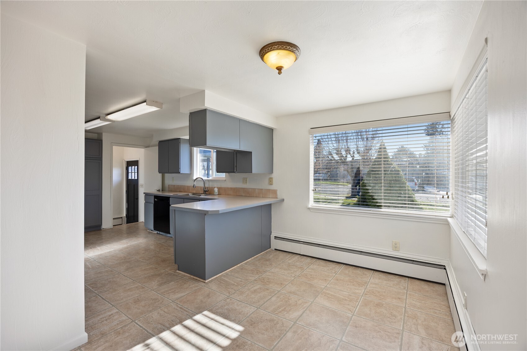 110 Linden Avenue Moses Lake, WA 98837 - Photo 14 of 40 a view of a kitchen with an oven and cabinets