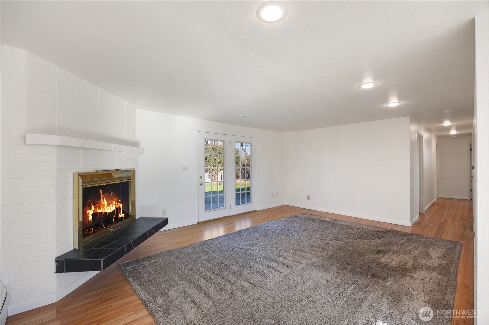 110 Linden Avenue Moses Lake, WA 98837 - Photo 15 of 40 a view of empty room with a fireplace