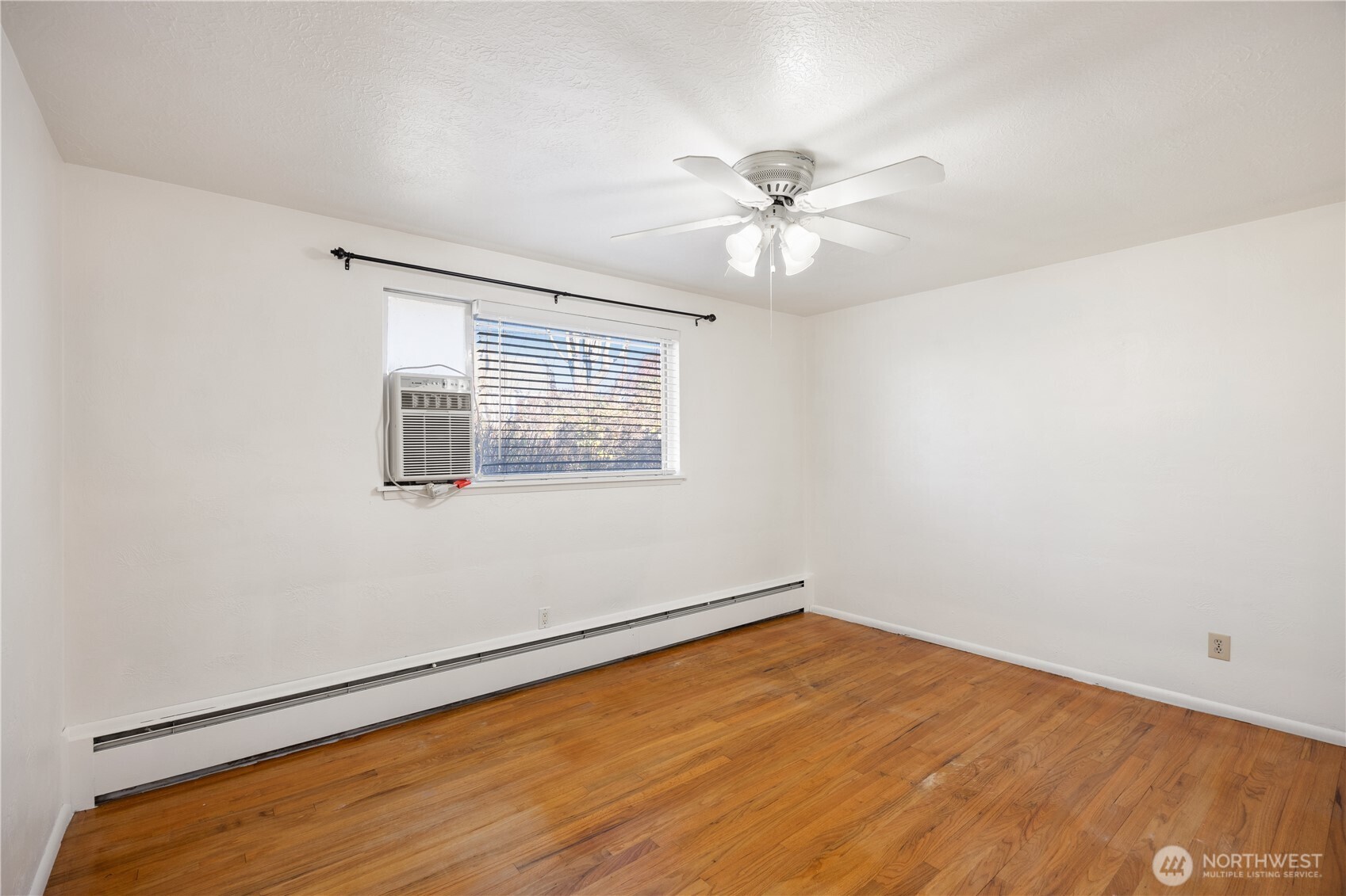 110 Linden Avenue Moses Lake, WA 98837 - Photo 21 of 40 a view of empty room with wooden floor