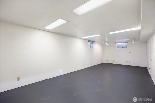 a view of a room with wooden floor