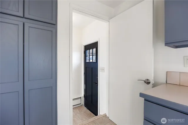 a kitchen with a sink appliances and cabinets