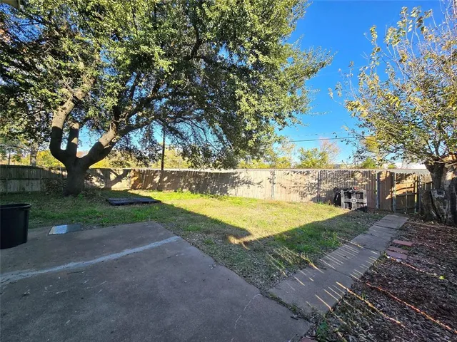 a view of yard with swimming pool and green space