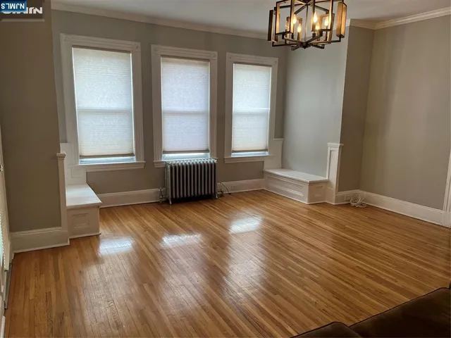 a view of a livingroom with furniture and front door