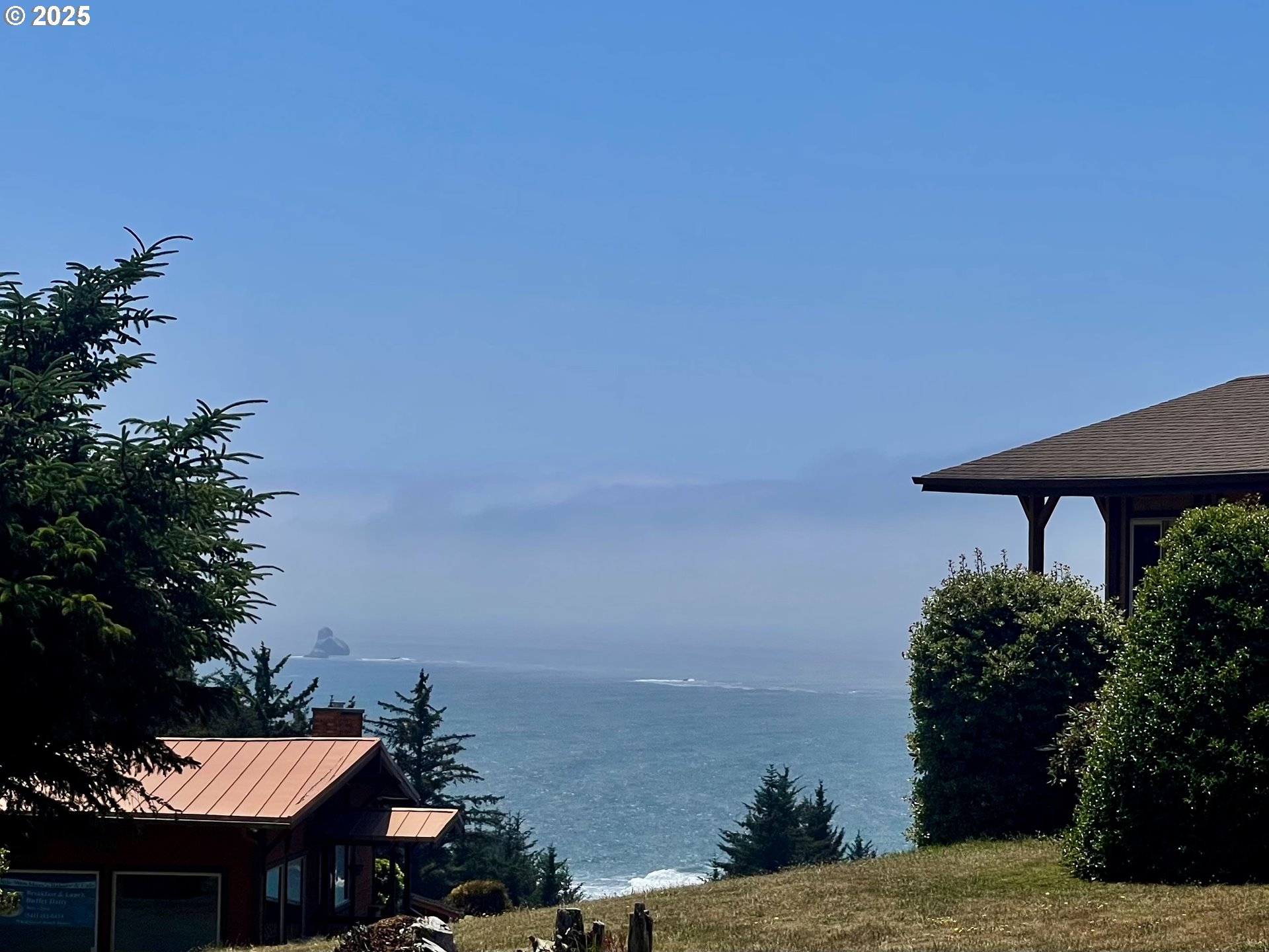19921 Whaleshead Road, Unit T5 Brookings, OR 97415 - Photo 18 of 34 a view of a terrace with chair and table