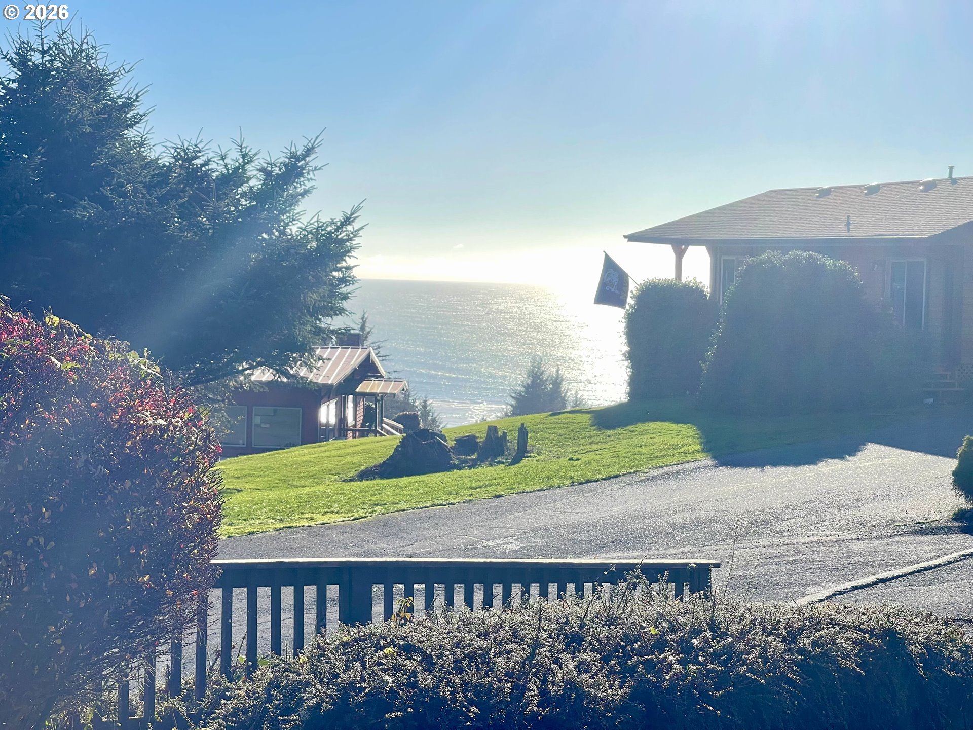 19921 Whaleshead Road, Unit T5 Brookings, OR 97415 - Photo 25 of 34 a view of a wooden fence next to a yard