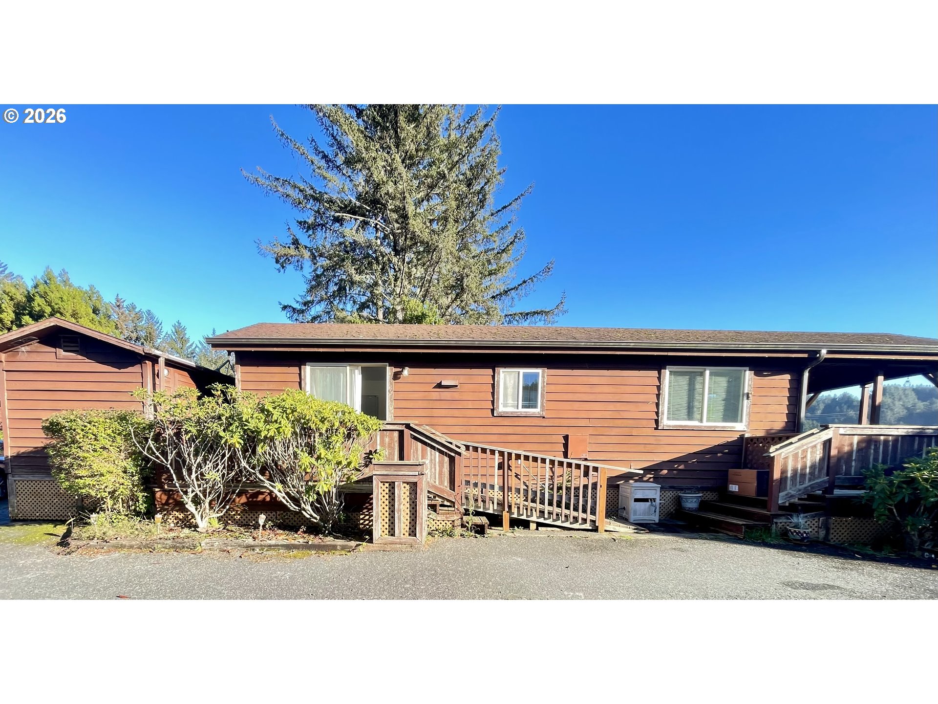 19921 Whaleshead Road, Unit T5 Brookings, OR 97415 - Photo 28 of 34 a black and white photo of a living room
