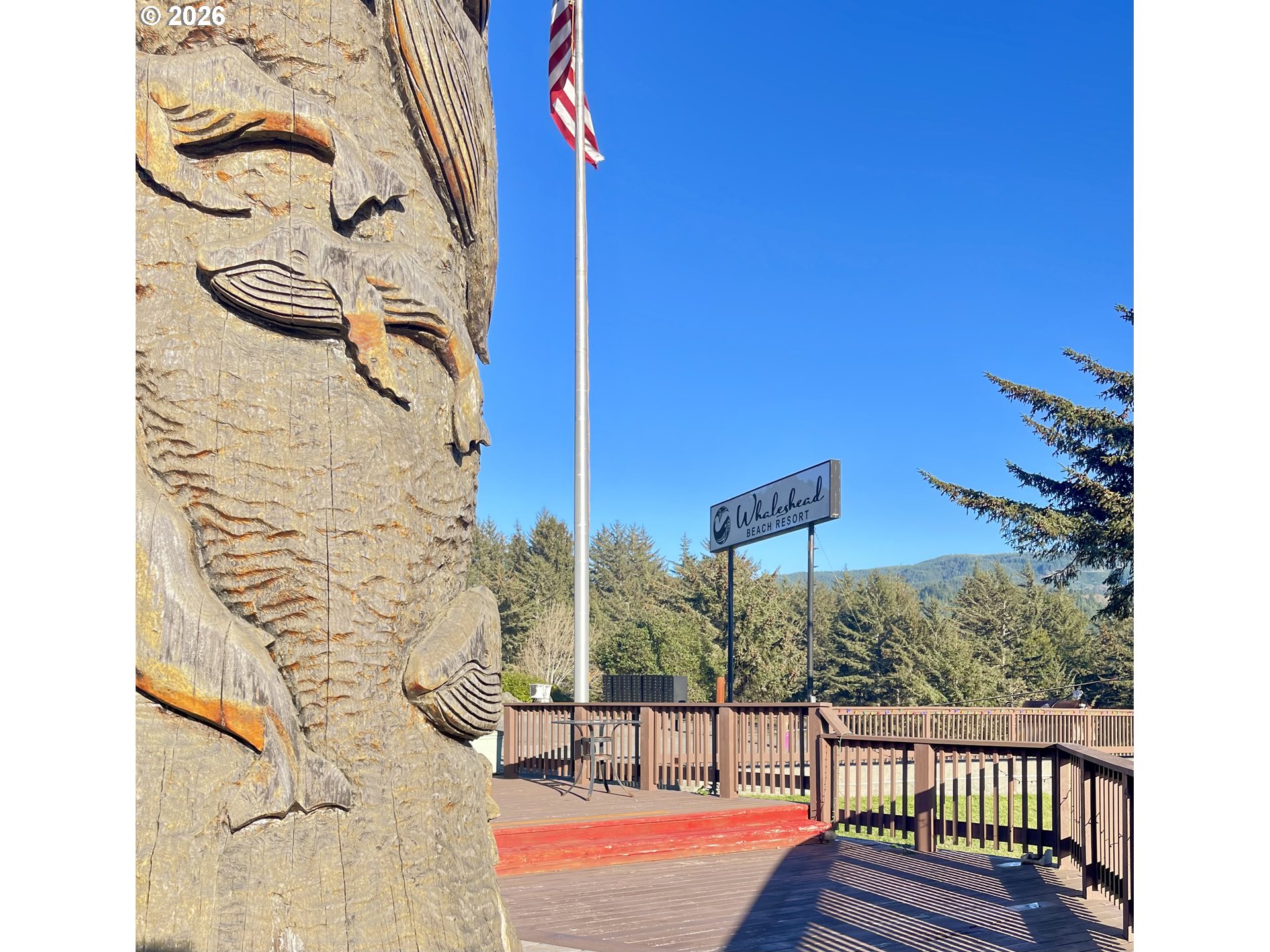 19921 Whaleshead Road, Unit T5 Brookings, OR 97415 - Photo 34 of 34 a view of a balcony with floor to ceiling windows with wooden floor