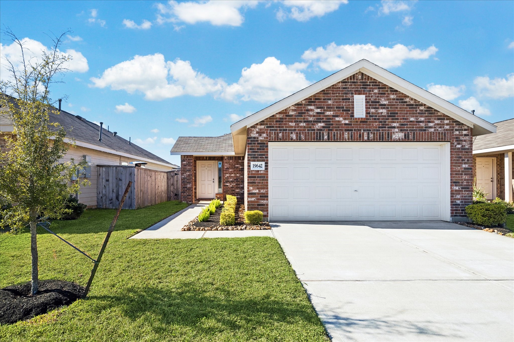 19642 Rupetti Drive New Caney, TX 77357 - Photo 1 of 14 a front view of a house with garden