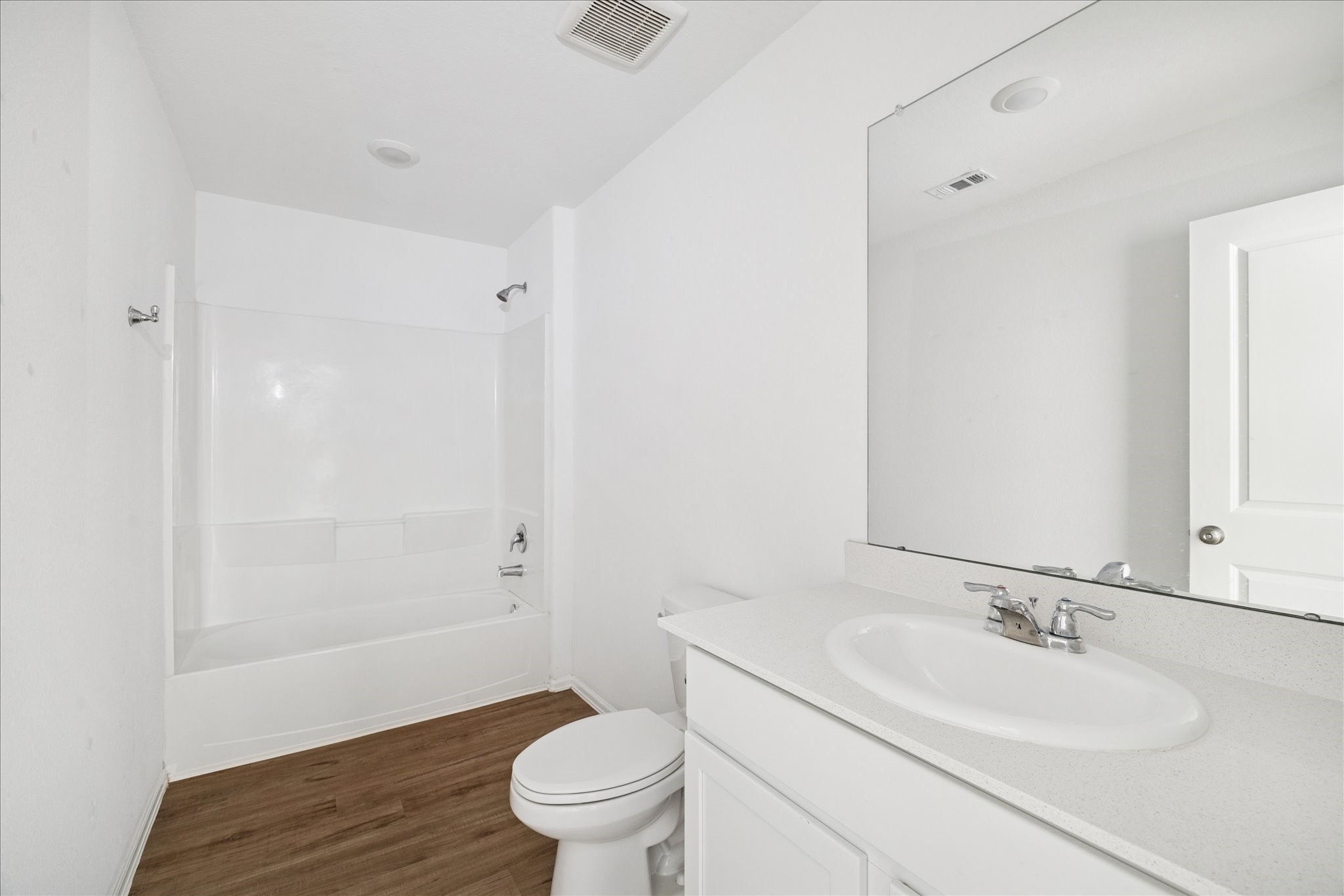 19642 Rupetti Drive New Caney, TX 77357 - Photo 11 of 14 a bathroom with a sink a toilet and shower