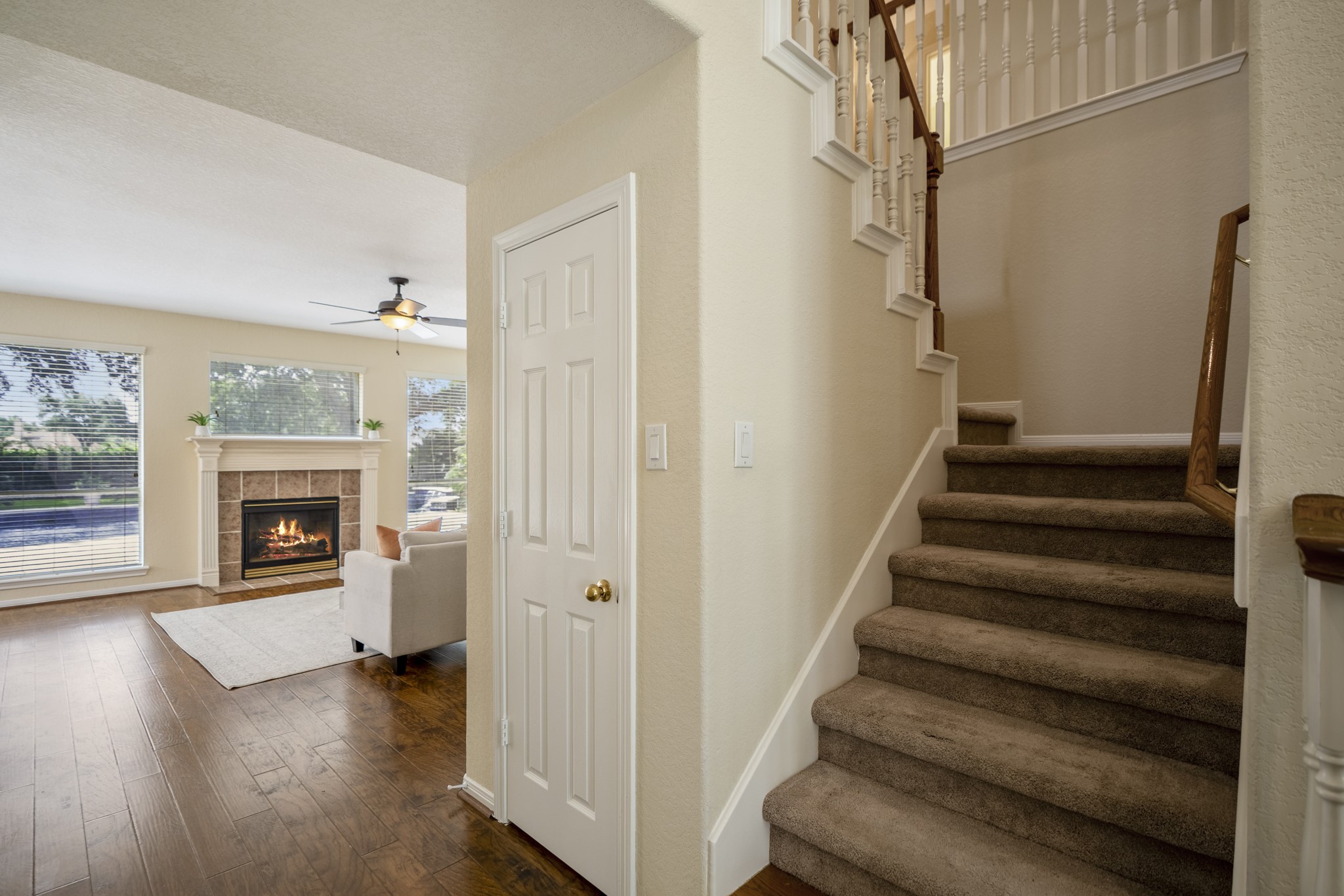 5807 Sequoia Trace Court Spring, TX 77379 - Photo 7 of 50 Just beyond the staircase, the layout opens into the main living area, where pool views, golf course scenery, and easy access to the backyard start to bring the Windrose lifestyle into focus.