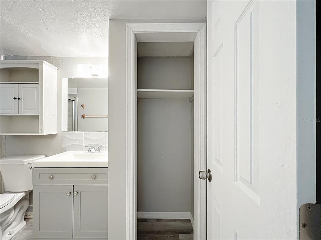 11705 3rd Street East, Unit 4 Treasure Island, FL 33706 - Photo 13 of 23 a bathroom with a sink and a mirror