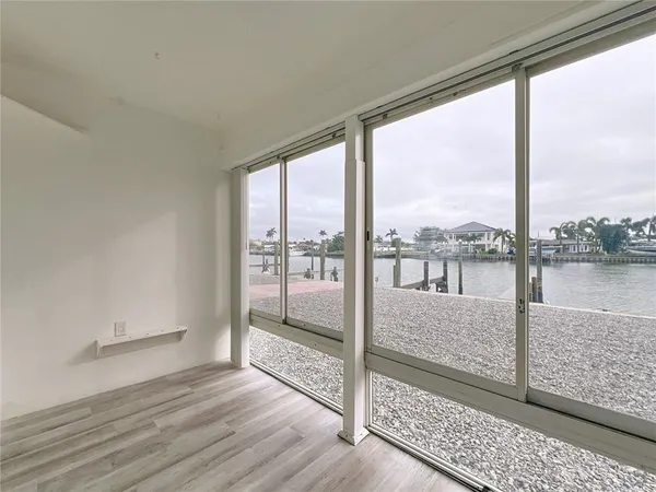 a view of a room with wooden floor and city view