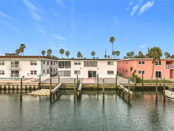 a view of a swimming pool with outdoor seating