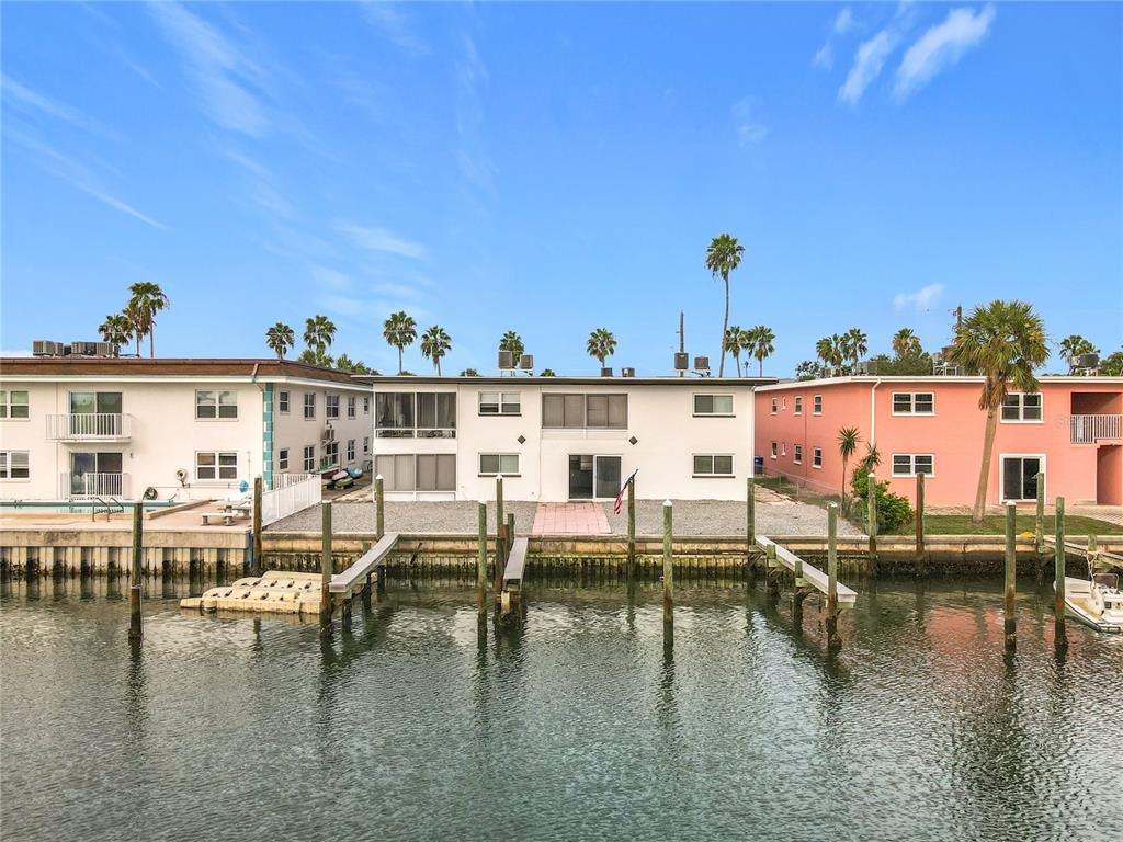 11705 3rd Street East, Unit 4 Treasure Island, FL 33706 - Photo 2 of 23 a view of a swimming pool with outdoor seating