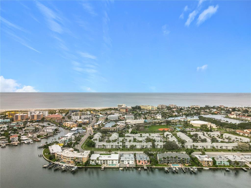 11705 3rd Street East, Unit 4 Treasure Island, FL 33706 - Photo 23 of 23 an aerial view of a city with lots of residential buildings and ocean view