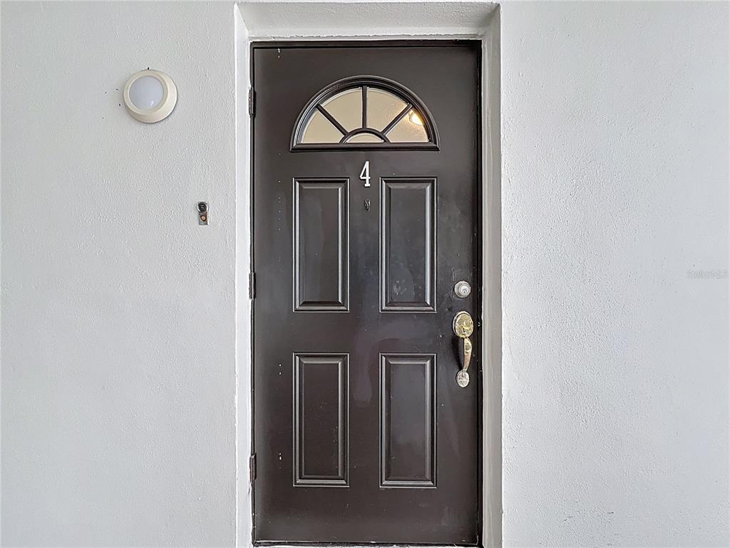 11705 3rd Street East, Unit 4 Treasure Island, FL 33706 - Photo 3 of 23 a view of entryway with wooden door