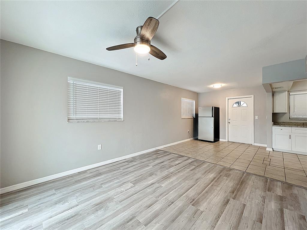 11705 3rd Street East, Unit 4 Treasure Island, FL 33706 - Photo 6 of 23 a view of empty room with wooden floor