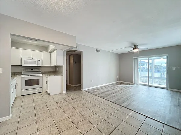 a view of a kitchen with a sink dishwasher and a refrigerator