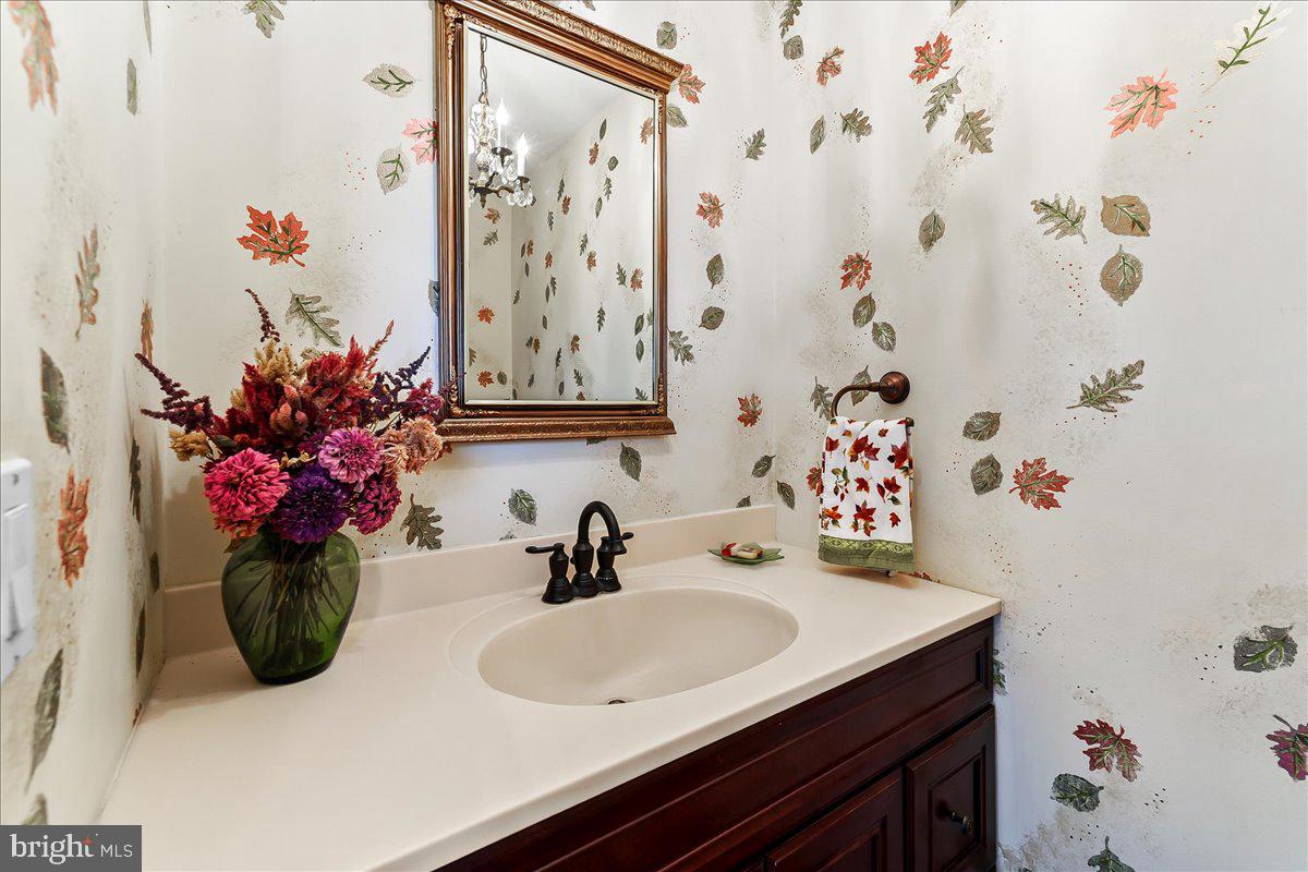701 Pheasant Run Kennett Square, PA 19348 - Photo 16 of 41 a bathroom with a sink and a mirror