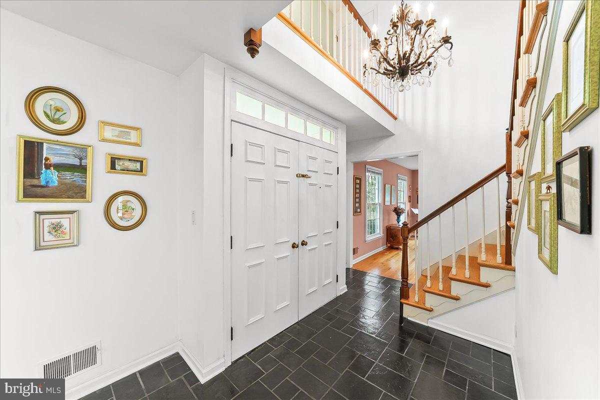 701 Pheasant Run Kennett Square, PA 19348 - Photo 18 of 41 a view of entryway with stairs and wooden floor