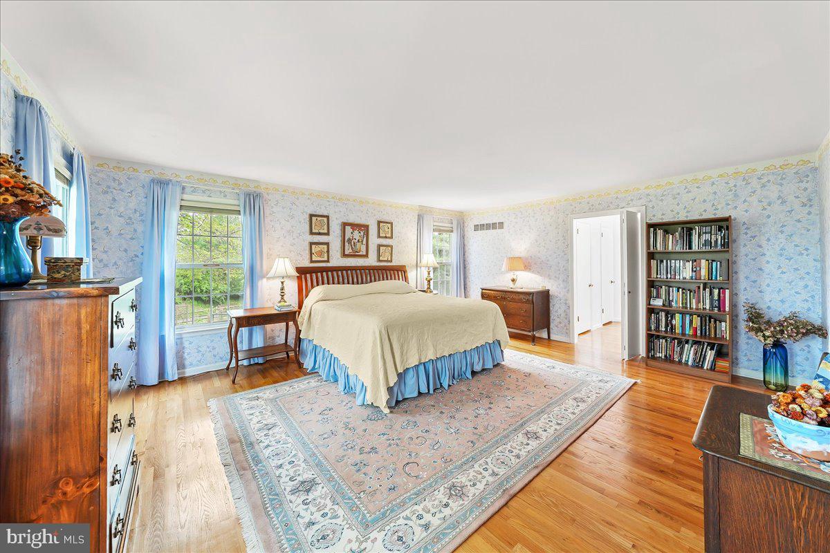 701 Pheasant Run Kennett Square, PA 19348 - Photo 21 of 41 a bedroom with a bed a bookshelf and a window