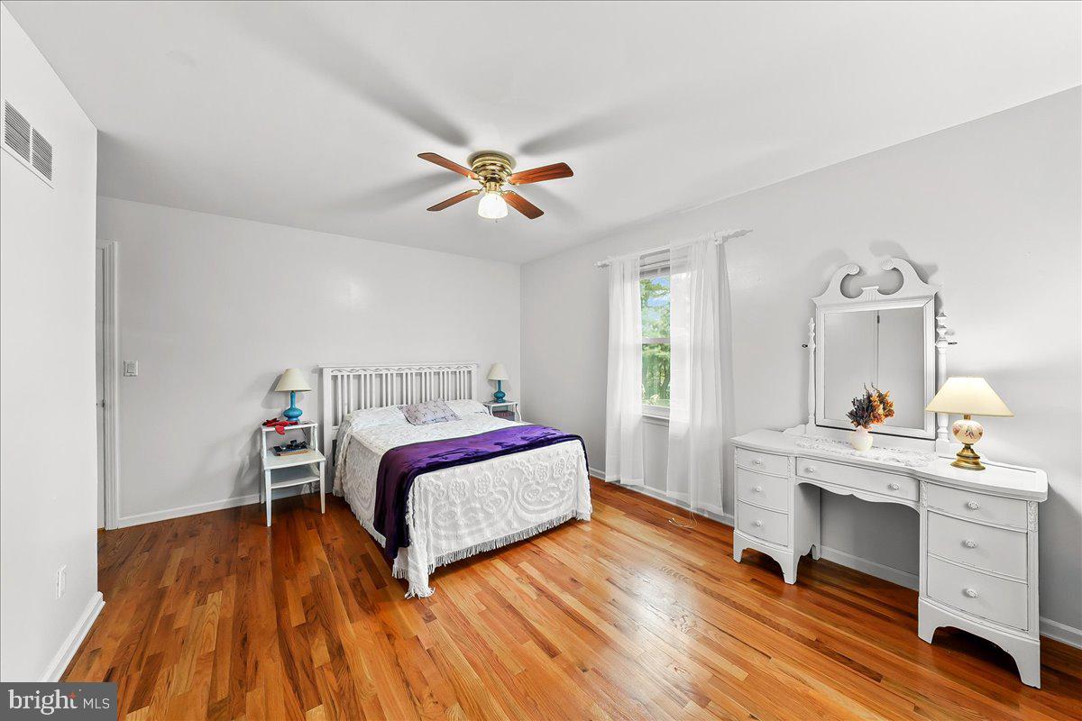 701 Pheasant Run Kennett Square, PA 19348 - Photo 25 of 41 a bedroom with a bed and a desk