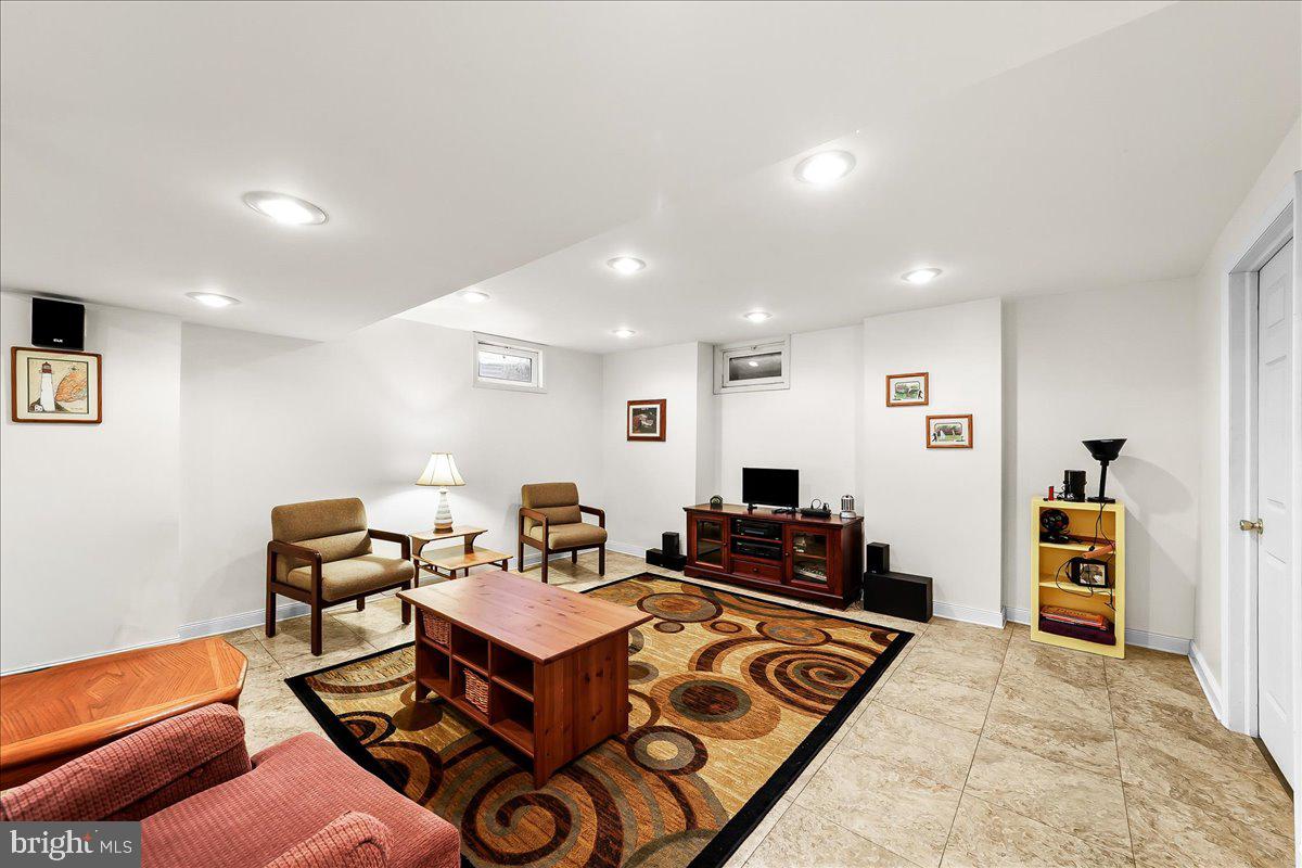 701 Pheasant Run Kennett Square, PA 19348 - Photo 29 of 41 a living room with furniture and a flat screen tv