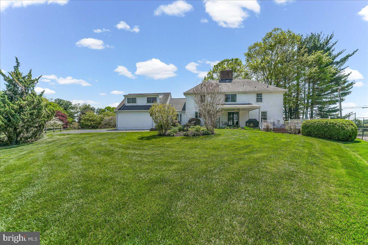 701 Pheasant Run Kennett Square, PA 19348 - Photo 3 of 41 a house view with a garden space