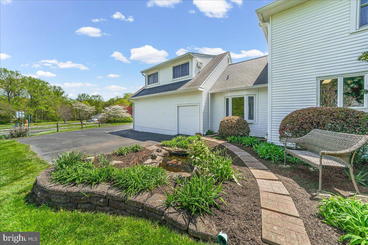 701 Pheasant Run Kennett Square, PA 19348 - Photo 33 of 41 a house view with a garden space