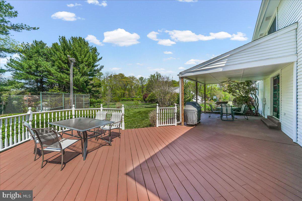 701 Pheasant Run Kennett Square, PA 19348 - Photo 34 of 41 a view of a chairs and table on the wooden deck