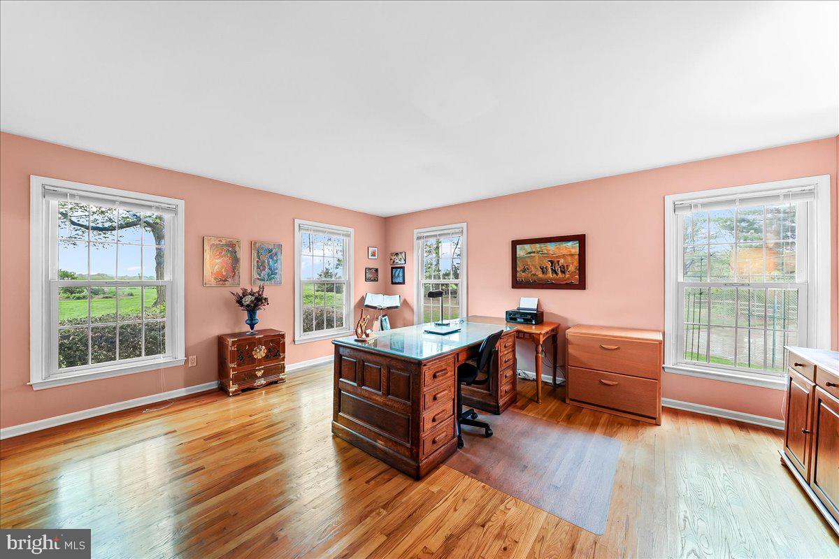 701 Pheasant Run Kennett Square, PA 19348 - Photo 9 of 41 a living room with furniture and a wooden floor