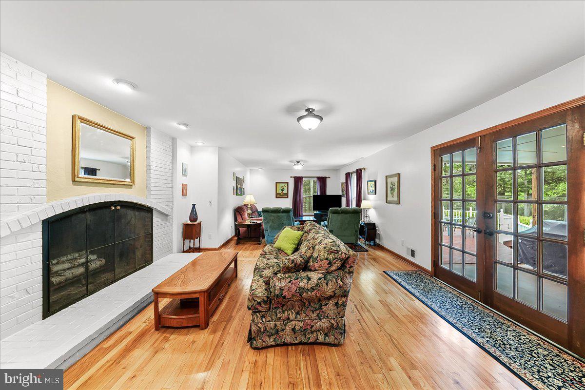 701 Pheasant Run Kennett Square, PA 19348 - Photo 10 of 41 a living room with furniture fireplace and flat screen tv