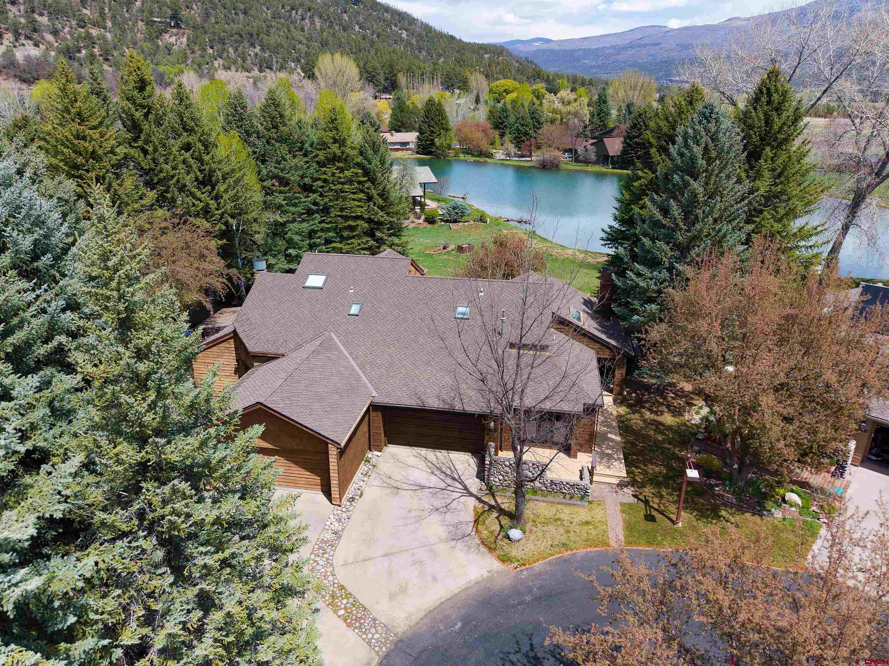 528 Cottonwood Creek Road Durango, CO 81301 - Photo 2 of 39 an aerial view of a house with garden space and a lake view