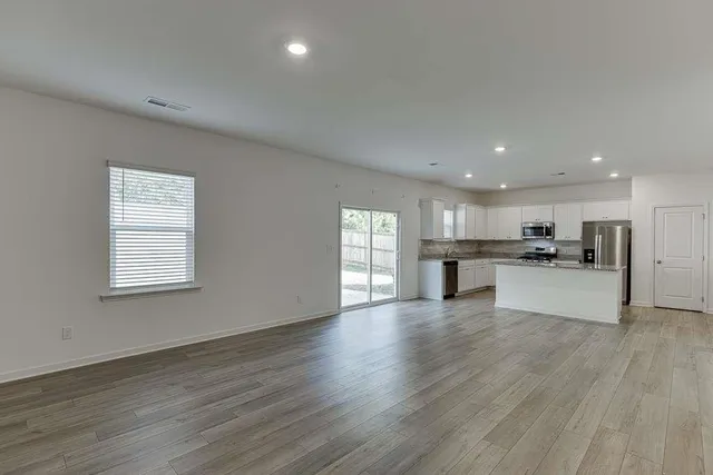 a view of kitchen with wooden floor