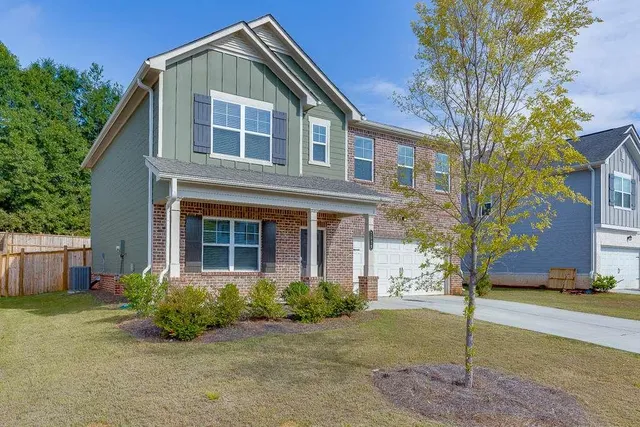 a front view of a house with garden