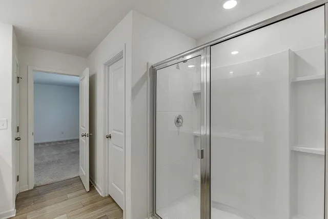 a bathroom with double sink and a mirror