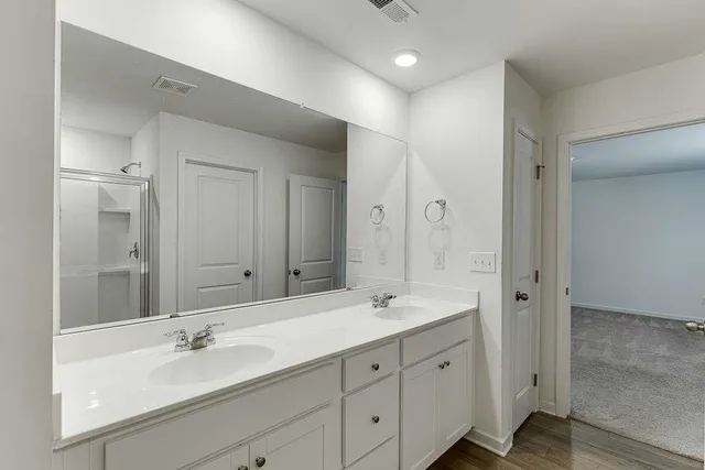 a view of a backyard with wooden fence