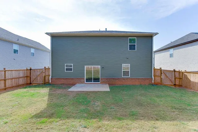 a backyard of a house with lots of green space