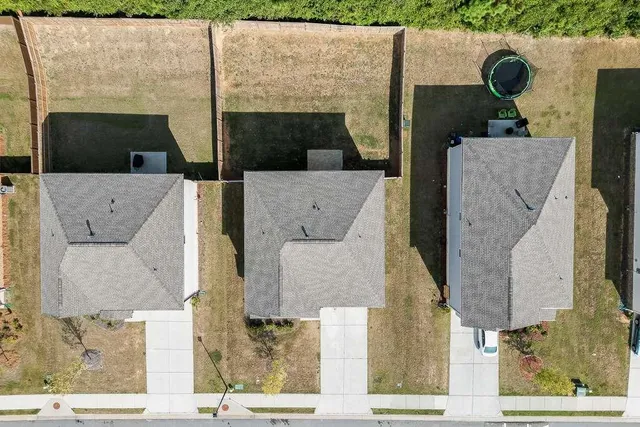 a view of multiple houses with yard