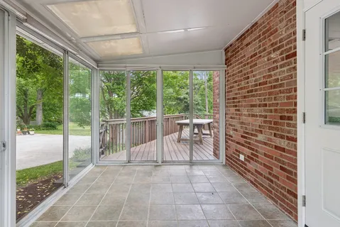 a view of a chairs and bench in the porch