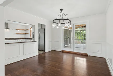 a view of a kitchen with a stove cabinets and wooden floor